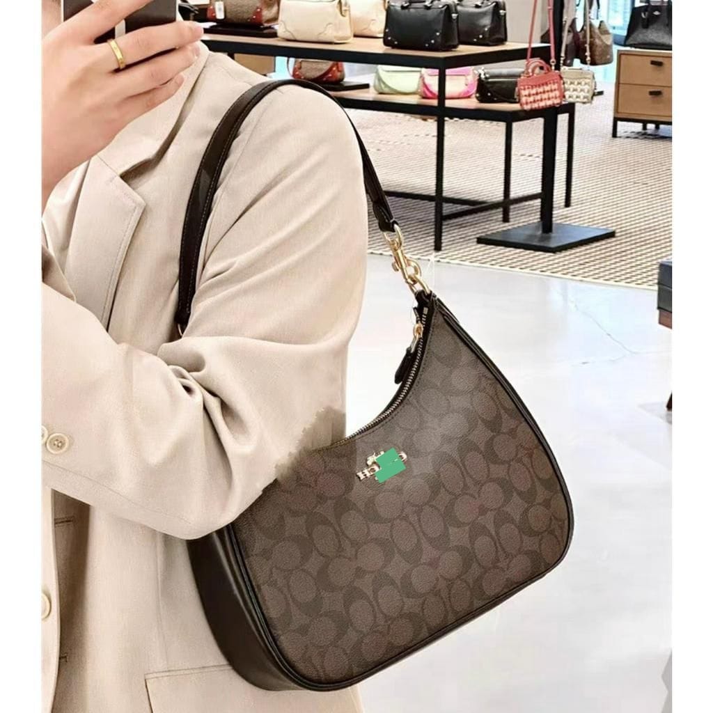 Monogram Curve Hobo β Signature Print Collection
